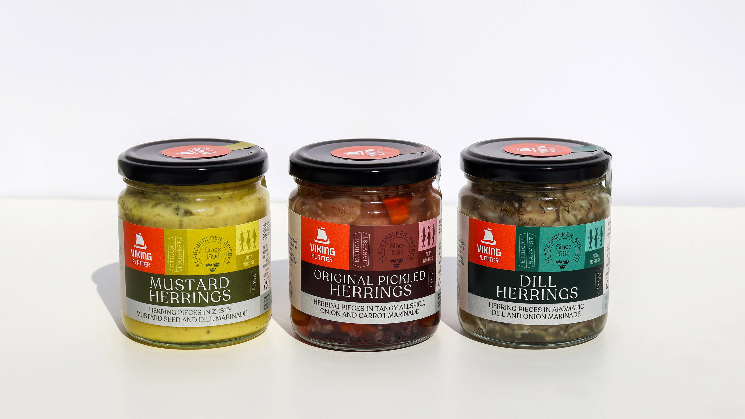 Trio of Viking Imports pickled herring packaging